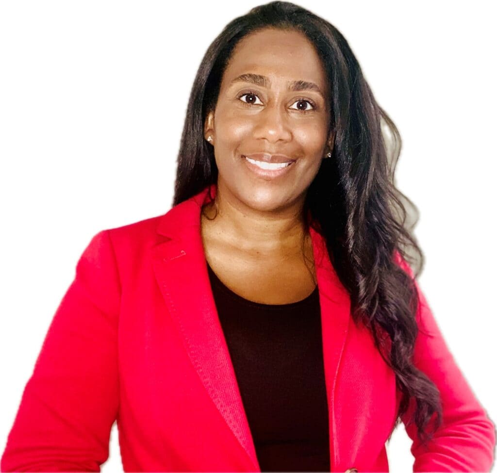 Headshot of Tamika Hewlett, Director, Audience Marketing, The Home Depot | Black business woman wearing pink/red blazer, black undershirt, and long wavy hair.